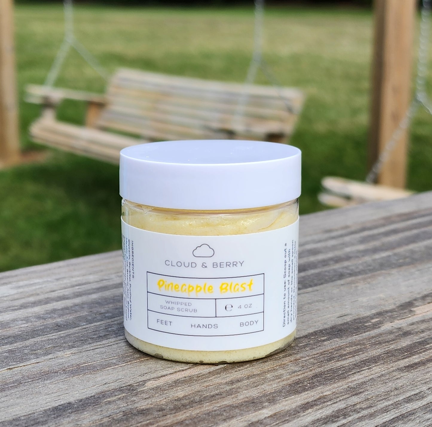 Pineapple whipped sugar scrub with yellow swirls.